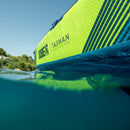 Close-up of a green and blue inflatable kayak with 'Jobe' and 'Tasman' branding on the water.